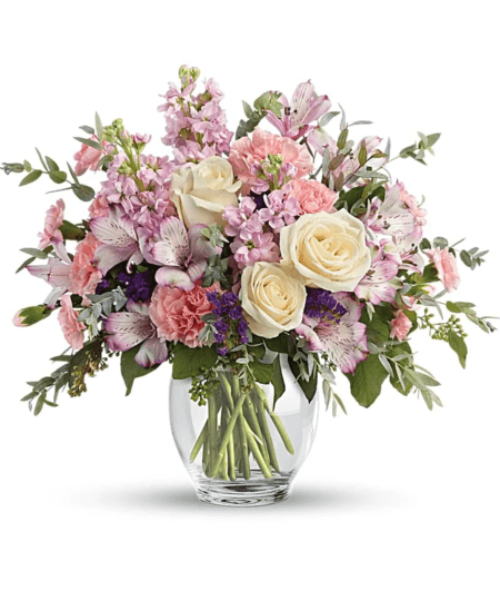 This lovely design is the perfect present for your special someone. This sweet arrangement includes white roses, lavender alstroemeria, pink carnations, pink stock, purple statice, and eucalyptus. 